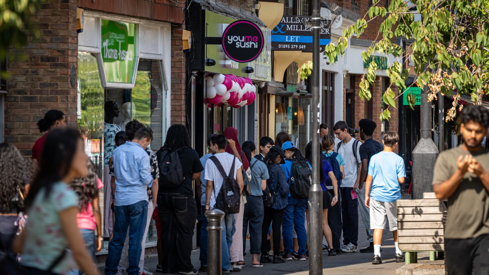 Queue outside a busy YouMeSushi store